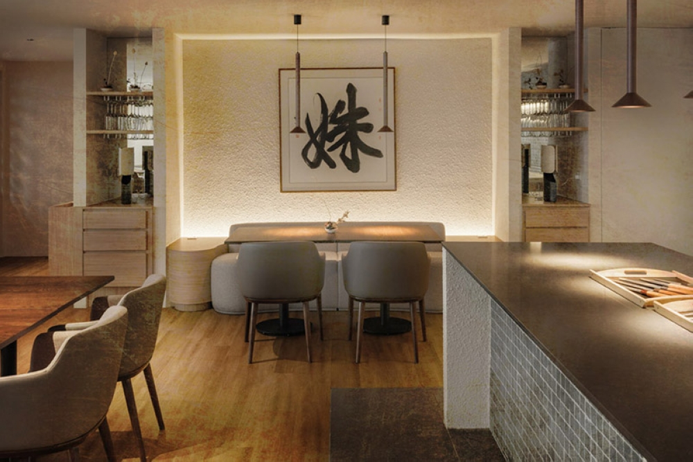 The warm tones of the restaurant décor, and a calligraphy centrepiece.