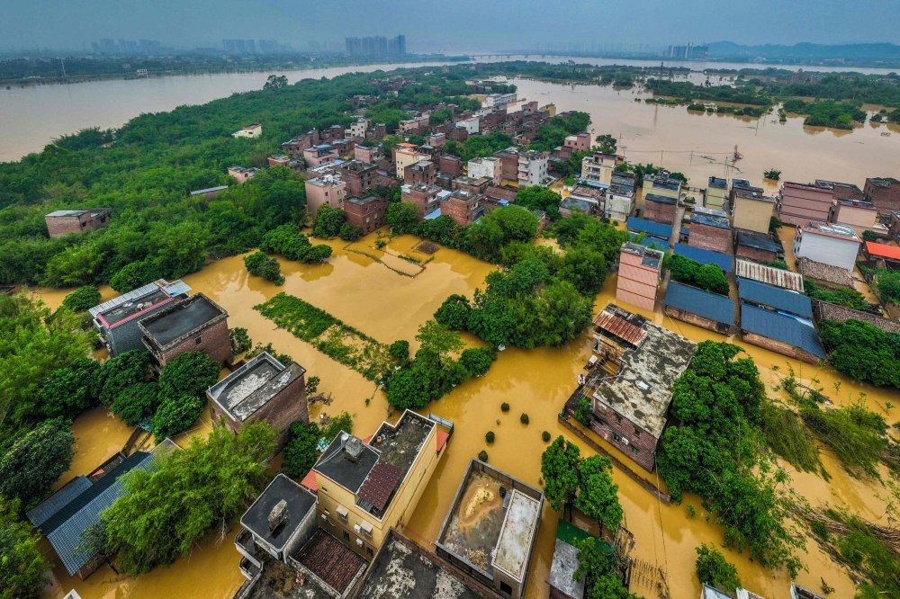 This aerial photograph taken on April 22, 2024 shows flooded buildings and streets after heavy rains in Qingyuan, in southern China's Guangdong province. — AFP pic