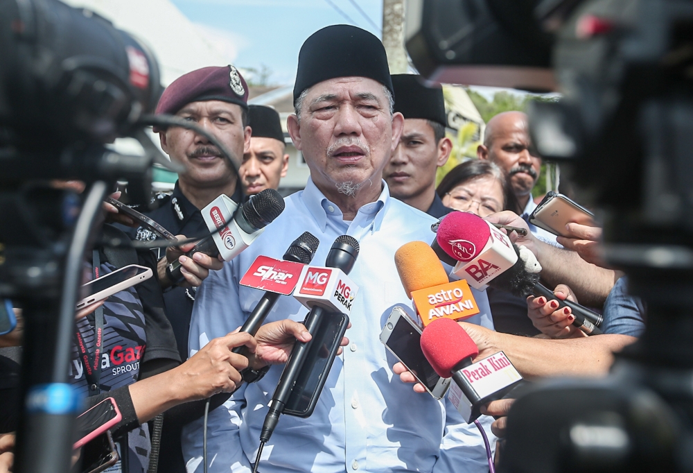 Deputy Prime Minister Datuk Seri Fadillah Yusof speaking to reporters outside the Royal Malaysian Navy (TLDM) camp in Lumut. — Picture by Farhan Najib