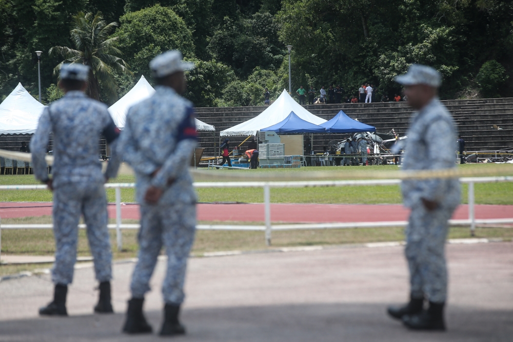 Picture shows the wreckage of one of the two helicopters that crashed at TLDM stadium, April 3, 2024, during training for a flyover for the 90th Navy Day celebration. — Picture by Farhan Najib