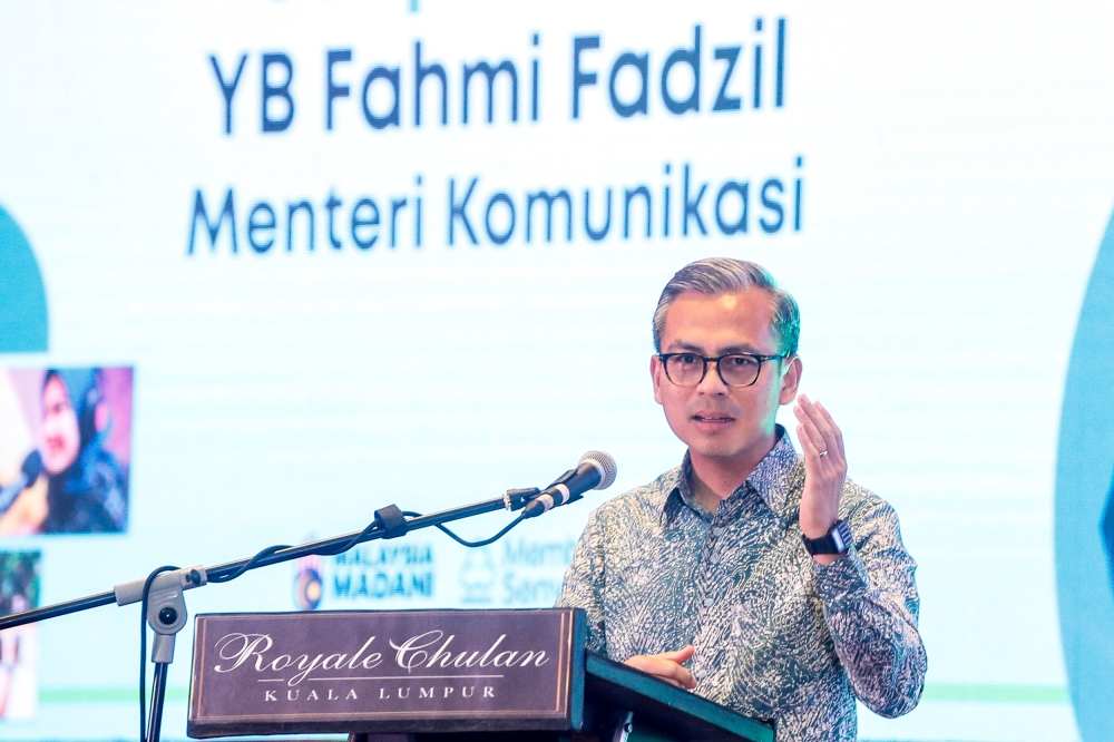 Communications Minister Fahmi Fadzil delivering a speech at the signing ceremony for MoU between Finas and Perkeso and Hari Raya Open House in Kuala Lumpur, April 23, 2024. — Picture by Hari Anggara.