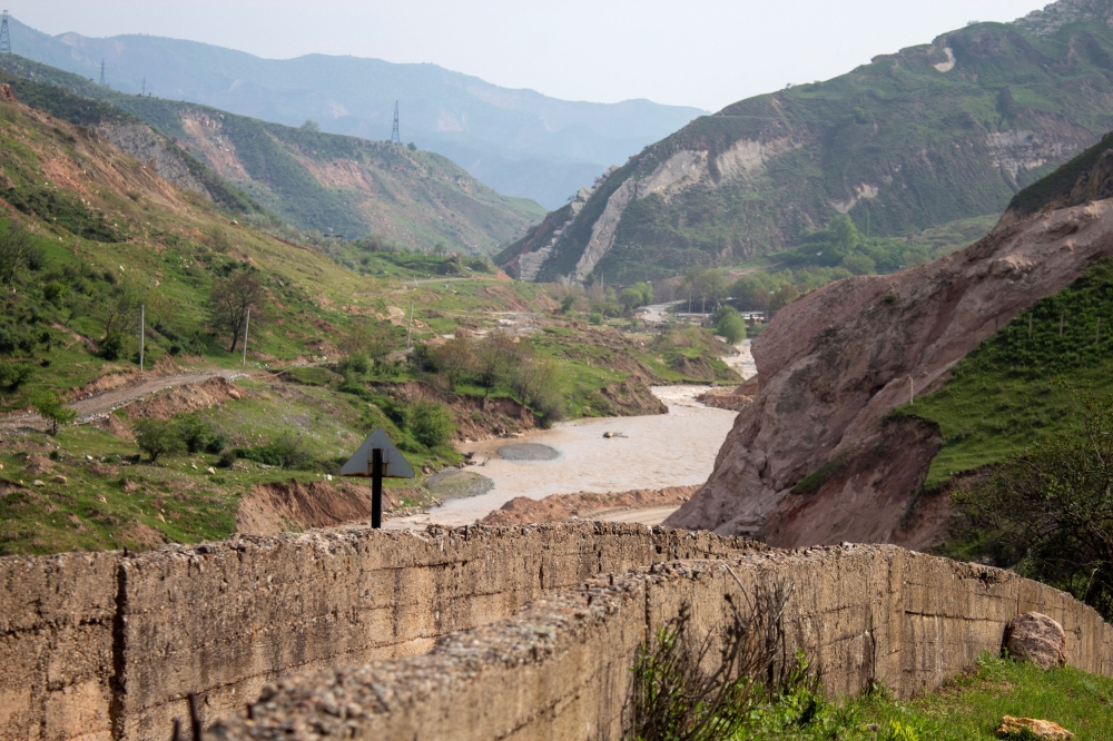 A view shows constructions on the bank of a river in a mountainous area near the town of Mailuu-Suu in the Jalal-Abad region, Kyrgyzstan, April 20, 2024. — Reuters pic