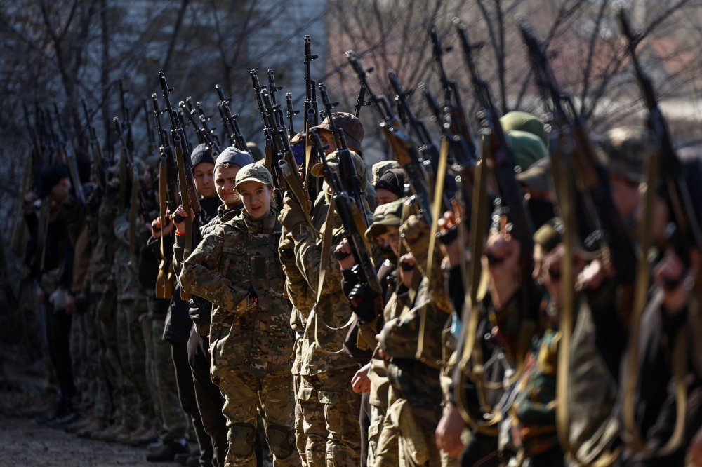 Potential recruits who aspire to join the 3rd Separate Assault Brigade of the Ukrainian Armed Forces take part in a testing basic military course, amid Russia's attack on Ukraine, in Kyiv, Ukraine March 27, 2024. — Reuters pic