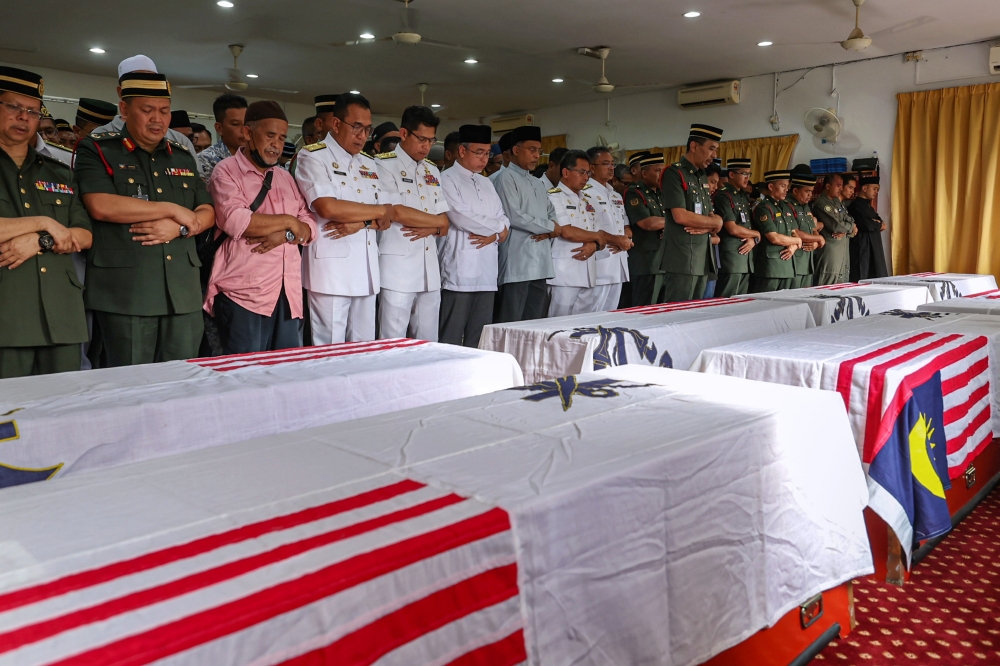 The remains of the eight victims of the helicopter crash at the Royal Malaysian Navy (RMN) Base Lumut arrived at the Surau Salahuddin Al-Ayubi of the 23rd Battalion of the Royal Malay Regiment for the funeral prayer, Ipoh, April 24, 2024. —
