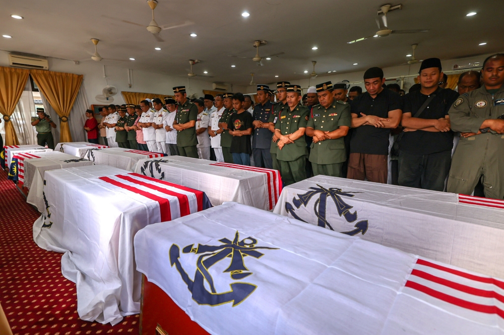 The remains of eight victims of the helicopter crash at the Royal Malaysian Navy Base Lumut arrive at the Surau Salahuddin Al-Ayubi of the 23rd Battalion of the Royal Malay Regiment for prayers and to be given last respects April 24, 2024. — Bernama pic