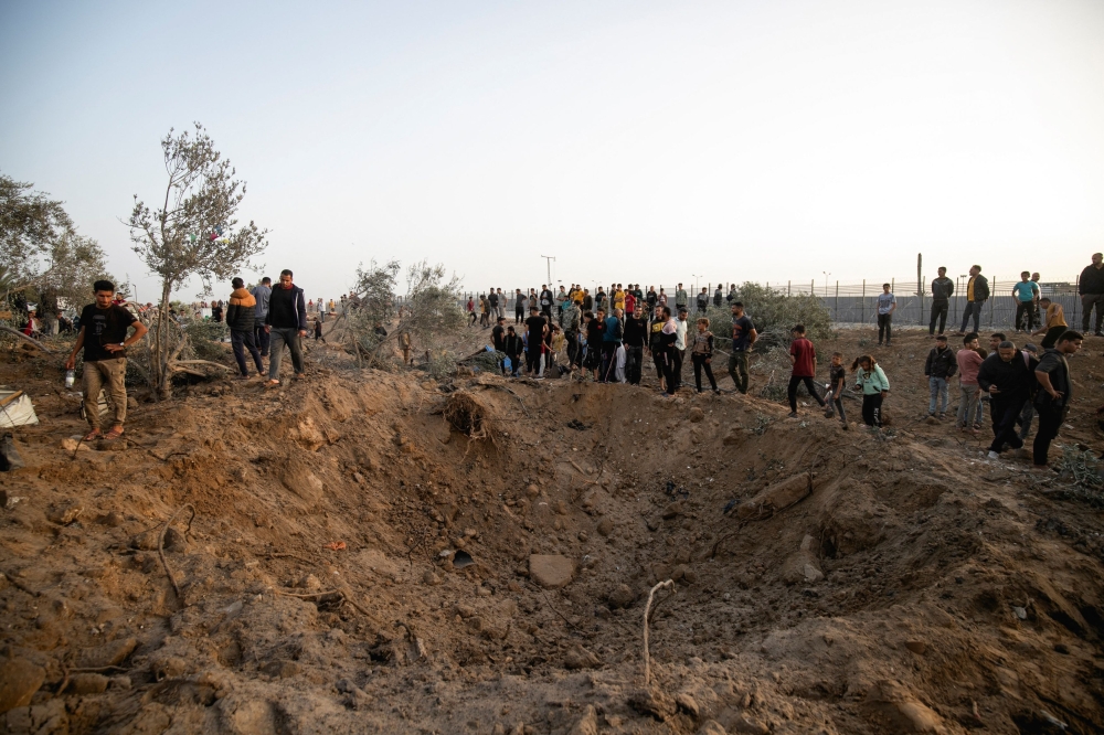 Displaced Palestinians inspect the site of an Israeli strike on a tent camp, amid the ongoing conflict between Israel and the Palestinian Islamist group Hamas, in Rafah, in the southern Gaza Strip April 22, 2024. — Reuters pic