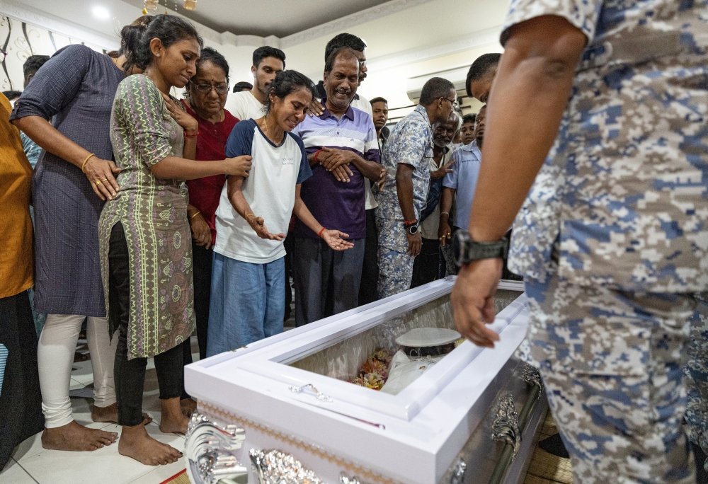 Family members and acquaintances could not contain their sadness as the body of the late Lt T Sivasutan, 31, arrived at his family’s residence in Taman Serdang Jaya in Sitiawan, Perak, April 24, 2024. — Bernama pic 