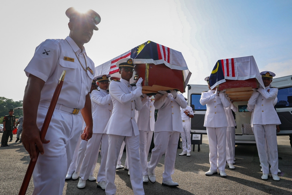 Members of the Royal Malaysian Navy carry the bodies of the helicopter crash victims at TLDM Lumut Base, arriving at Salahuddin Al-Ayubi Surau at the 23rd Malay Royal Regiment camp in Ipoh, April 24, 2024. — Bernama pic 