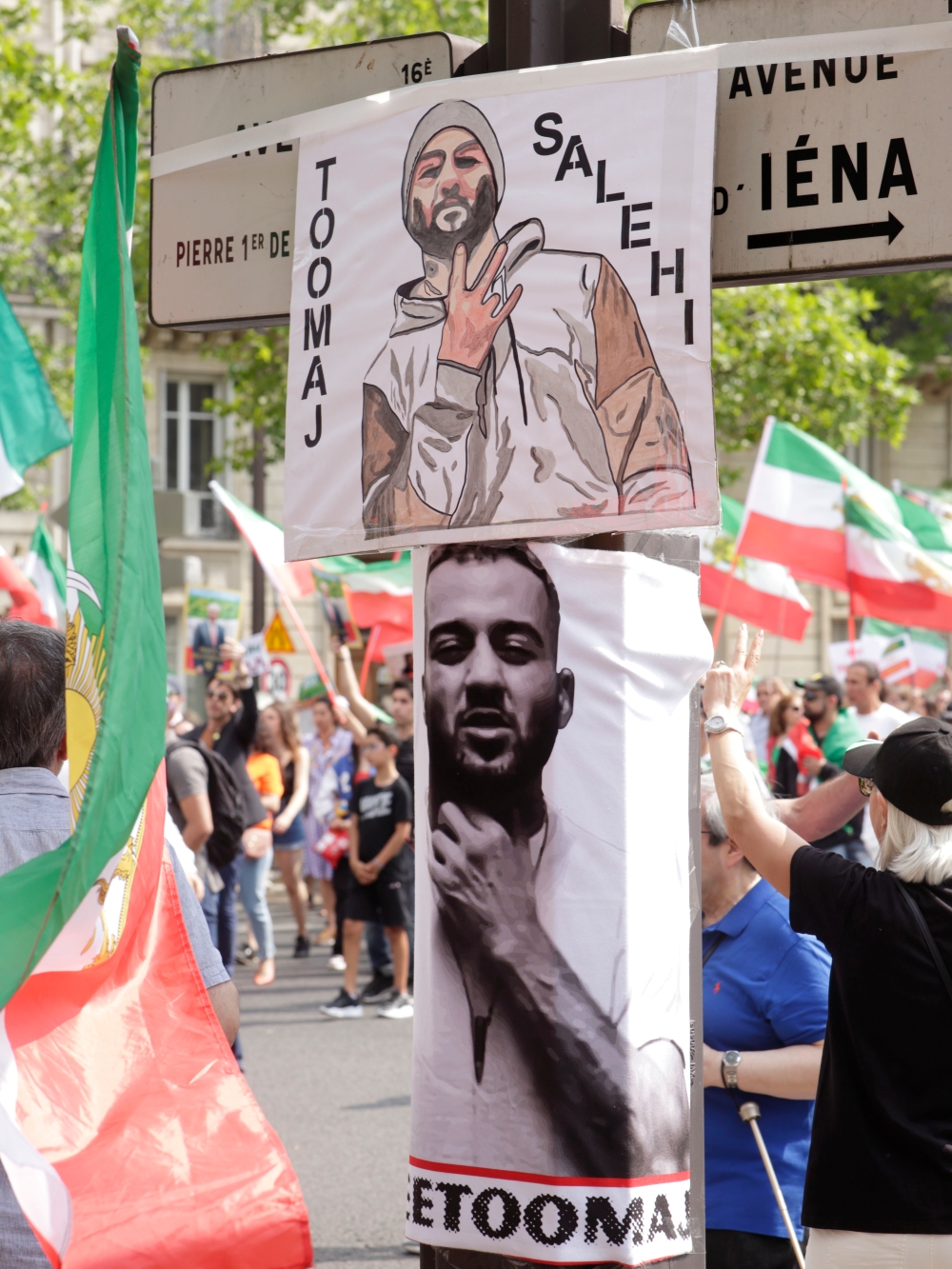 Led by the association Femme Azadi, but also the association We are iranian students, demonstrators and part of the Iranian diaspora gathered to denounce the mullahs regime, with the main slogan: Women live free. In the foreground, posters by Toomaj Salehi, a rapper and opponent of the regime. — Photography by Nicolas Rongier / Hans Lucas.