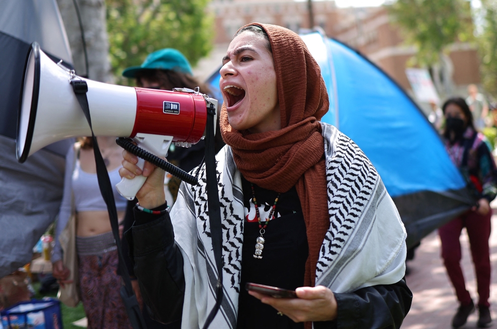 Pro-Palestine demonstrators march at an encampment in support of Gaza at the University of Southern California. — AFP pic