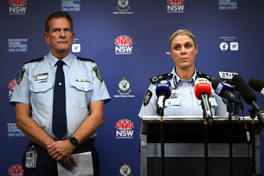 Australian Federal Police Deputy Commissioner Krissy Barrett along with NSW Police Deputy Commissioner David Hudson speak to media during a news conference after a number of search warrants were executed by the Joint Counter Terrorism Team in Sydney April 24, 2024. — Reuters pic/AAP/Dan Himbrechts