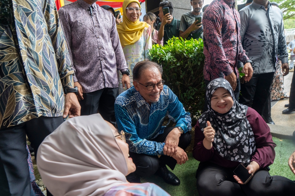 Prime Minister Datuk Seri Anwar Ibrahim attends the Madani Muhibbah Aidilfitri open house at Anjung, Communications Ministry in Putrajaya, April 25, 2024. — Picture by Shafwan Zaidon