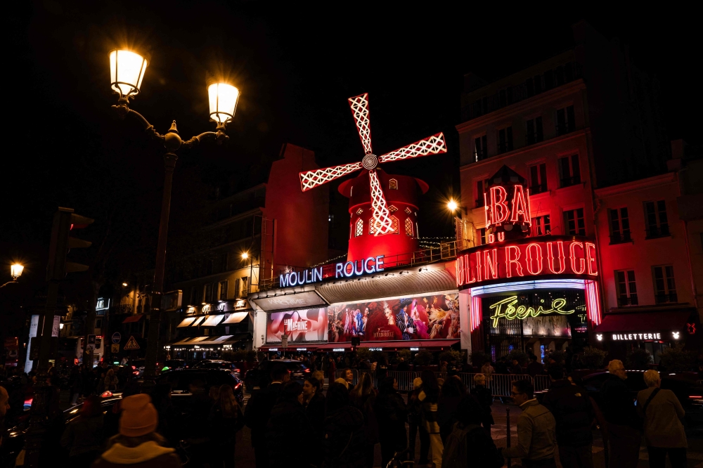 A photograph taken in Paris on April 9, 2024, shows an outside view of the Moulin Rouge musical cabaret. — AFP pic