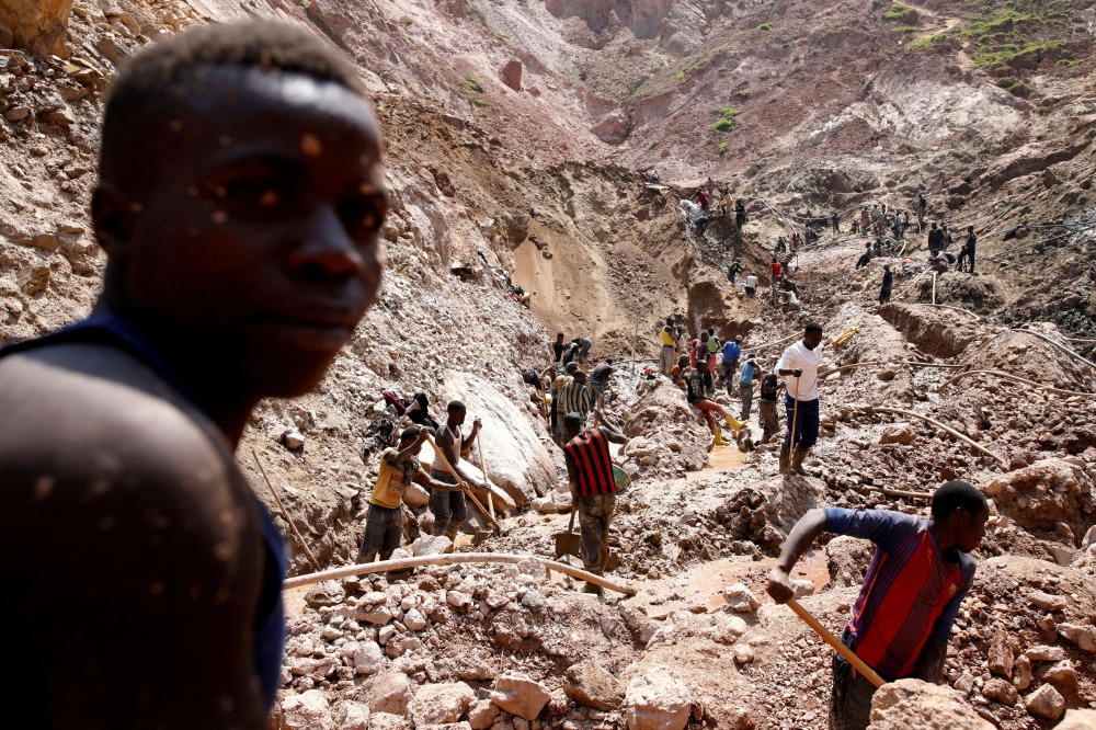 Labourers work at an open shaft of the SMB coltan mine near the town of Rubaya in the Eastern Democratic Republic of Congo, August 13, 2019. — Reuters file pic