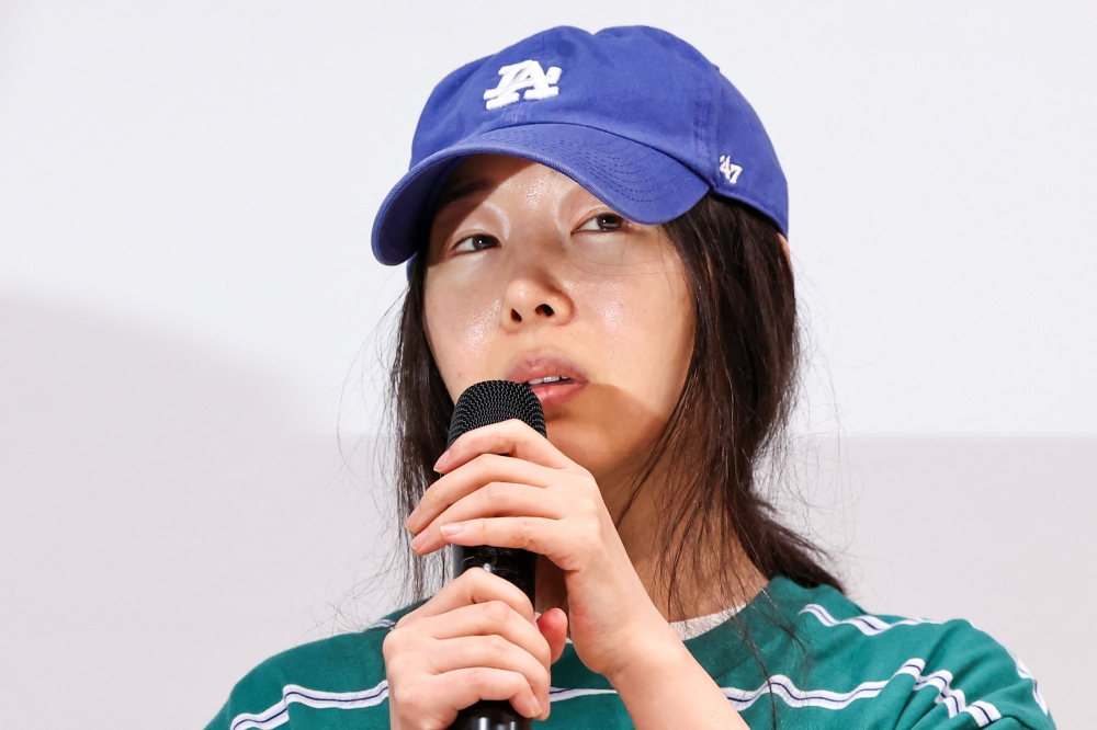 Min Hee-jin, a famed super-producer, denied the accusations in a tearful news conference this afternoon and claimed she has “no interest” in management rights. — Yonhap pic via AFP