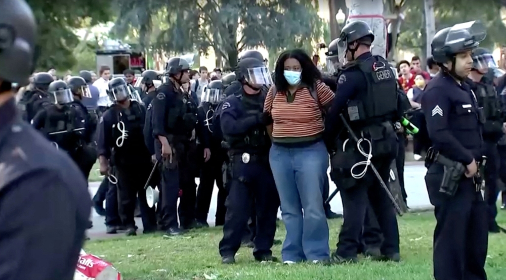 Police arrest a pro-Palestinian protester at USC campus in Los Angeles, California April 25, 2024, as seen in this screen grab obtained from a video.  — Screenshot of video obtained by Reuters