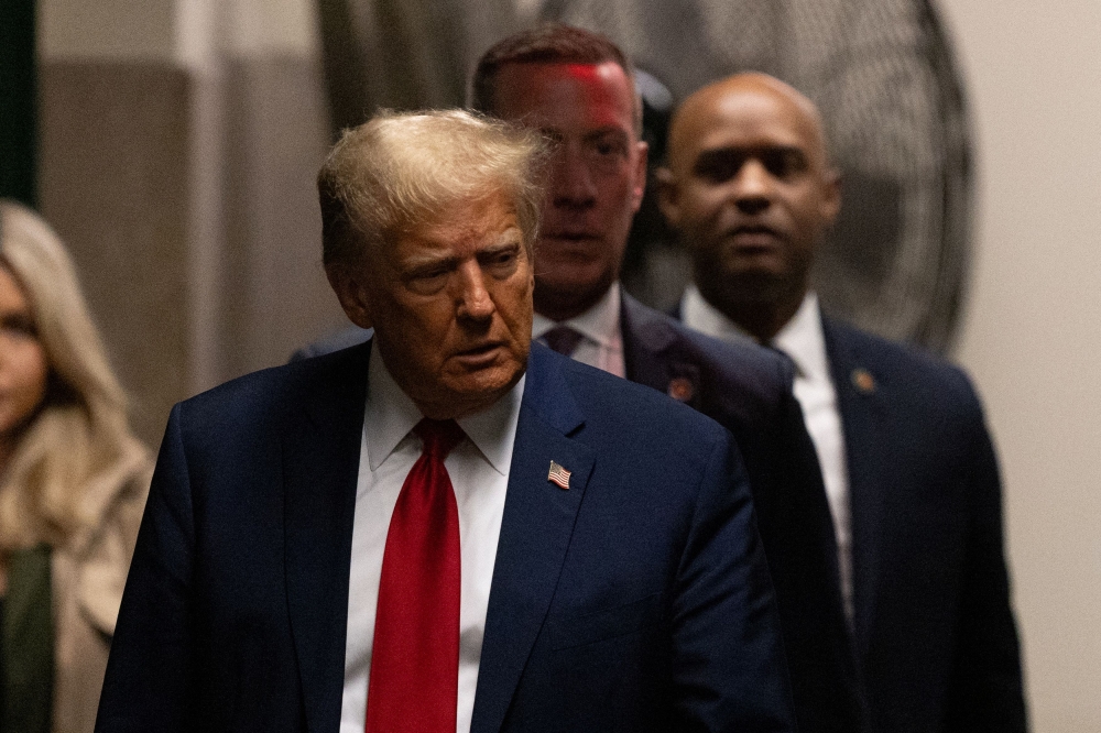 Former US President Donald Trump arrives at at Manhattan criminal court in New York, US, on Thursday, April 25, 2024. — Pool via Reuters pic