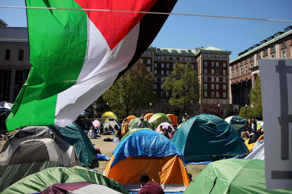 Pro-Palestinian students and activists gather at a protest encampment on the campus of Columbia University in New York City on April 25, 2024. — AFP pic