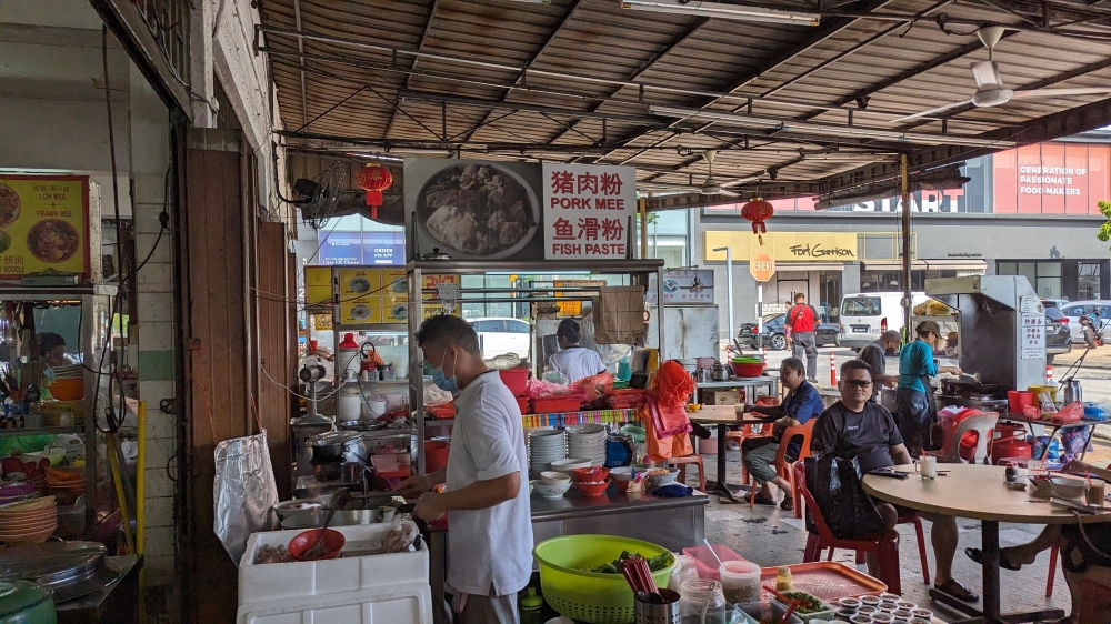 Look for the stall that says 'pork mee' and 'fish paste' on the sign; alternatively, look for the busiest stall at any given time, and it’ll usually be the right one.
