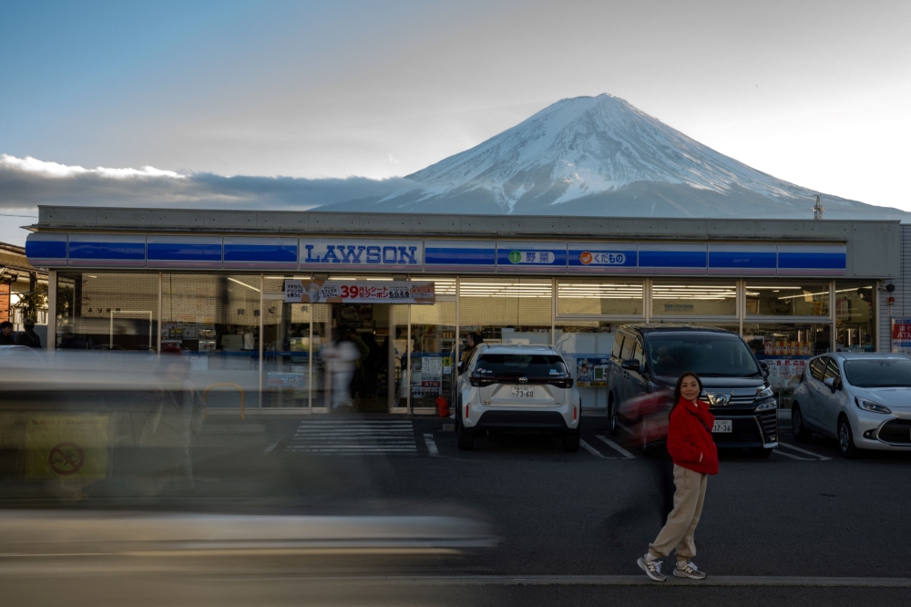 This viewpoint is particularly popular because the majestic volcano appears behind a Lawson convenience store, which are ubiquitous in Japan. — AFP pic