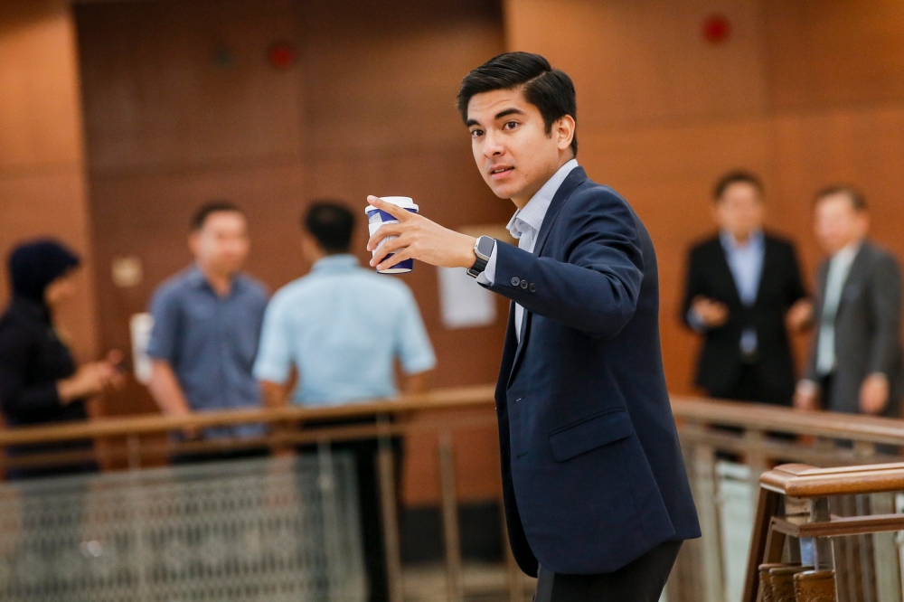 Communications Minister Fahmi Fadzil today reminded Muar Member of Parliament Syed Saddiq Abdul Rahman not to be hypocritical when claiming that the ruling government is keen to take action against its critics on social media. — Picture by Hari Anggara