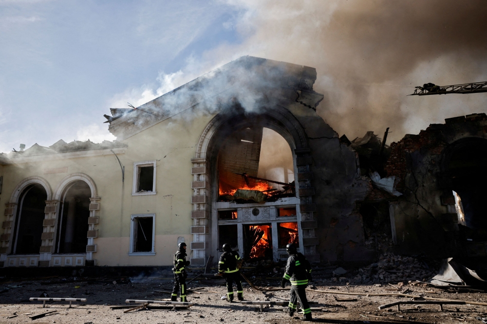 Firefighters work at the scene of a Russian missile strike that destroyed a train station, amid Russia's attack on Ukraine, in Kostyantynivka, Ukraine February 25, 2024. — Reuters pic