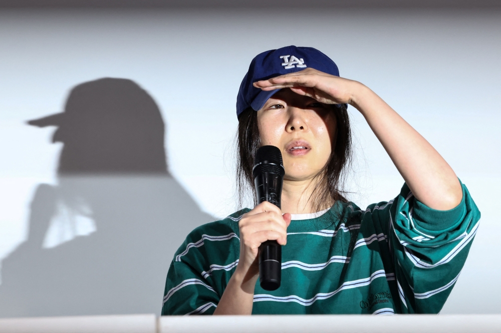 Min Hee-jin, famed superproducer and chief of ADOR, a powerhouse subsidiary of HYBE, speaks during a press conference in Seoul on April 25, 2024. — AFP pic