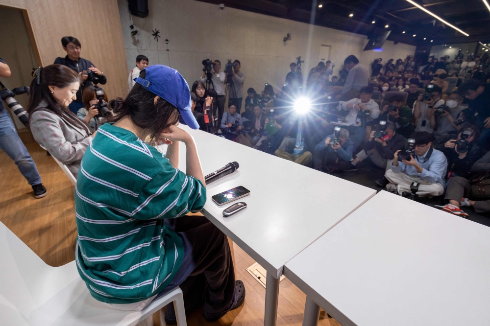 Min Hee-jin, famed superproducer and chief of ADOR, a powerhouse subsidiary of HYBE, speaks during a press conference in Seoul on April 25, 2024. — AFP pic