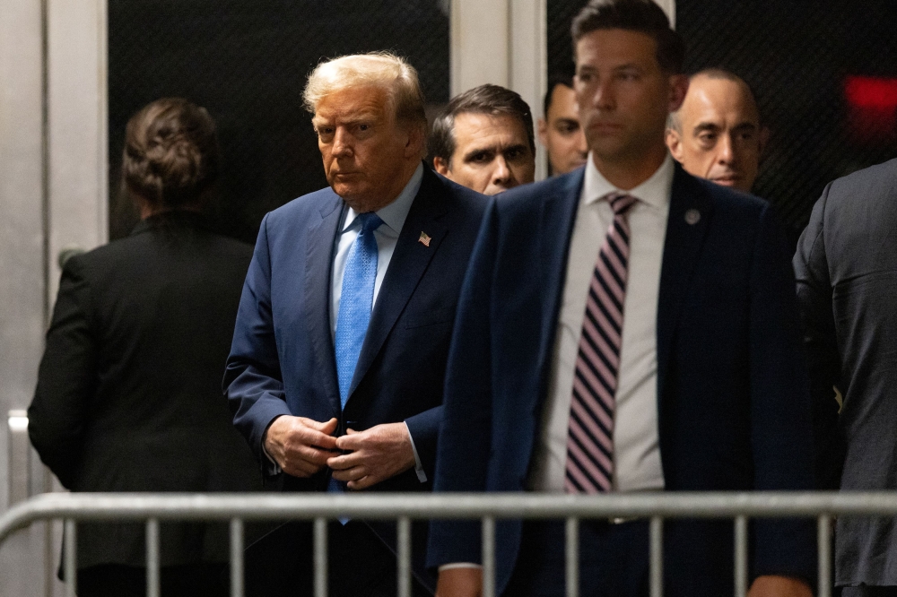File photo of former US President Donald Trump walking at Manhattan criminal court in New York, US, on Friday, April 26, 2024. — Reuters pic