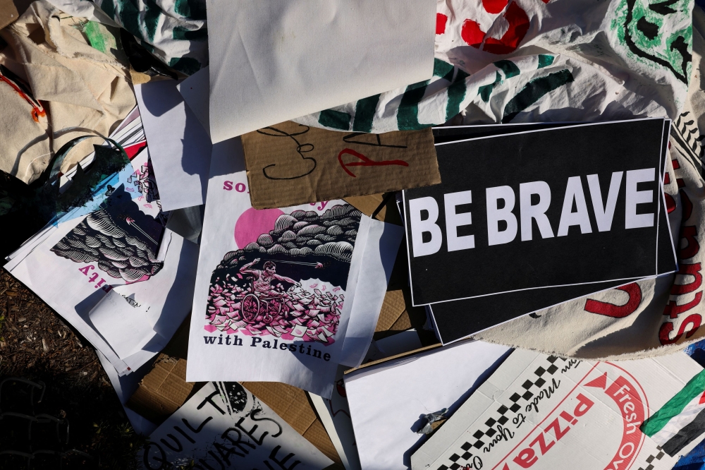 Signs are seen as students continue to maintain a protest encampment in support of Palestinians at Columbia University, during the ongoing conflict between Israel and the Palestinian Islamist group Hamas, in New York City, US, April 26, 2024. — Reuters pic