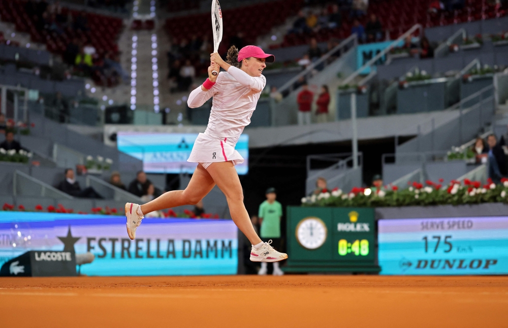 Poland's Iga Swiatek returns the ball to Romania's Sorana Cirstea during their second round of the 2024 WTA Tour Madrid Open tournament tennis match at Caja Magica in Madrid April 27, 2024. — AFP pic