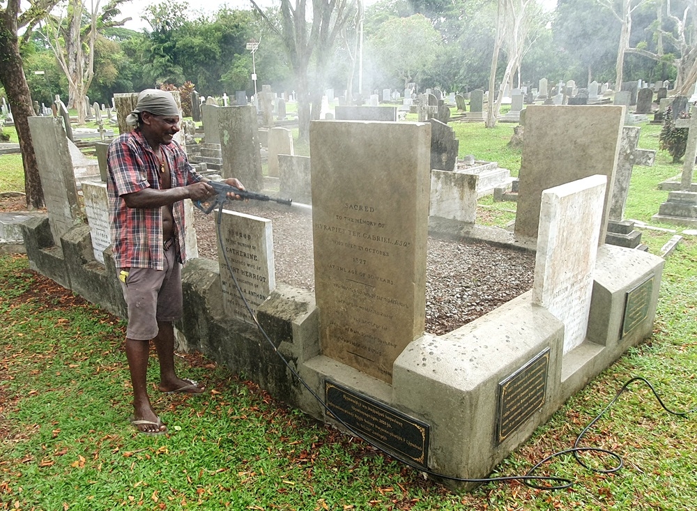 Cleaning works at the Armenians’ combined plot at Western Road Cemetery. — Picture courtesy of Marcus Langdon