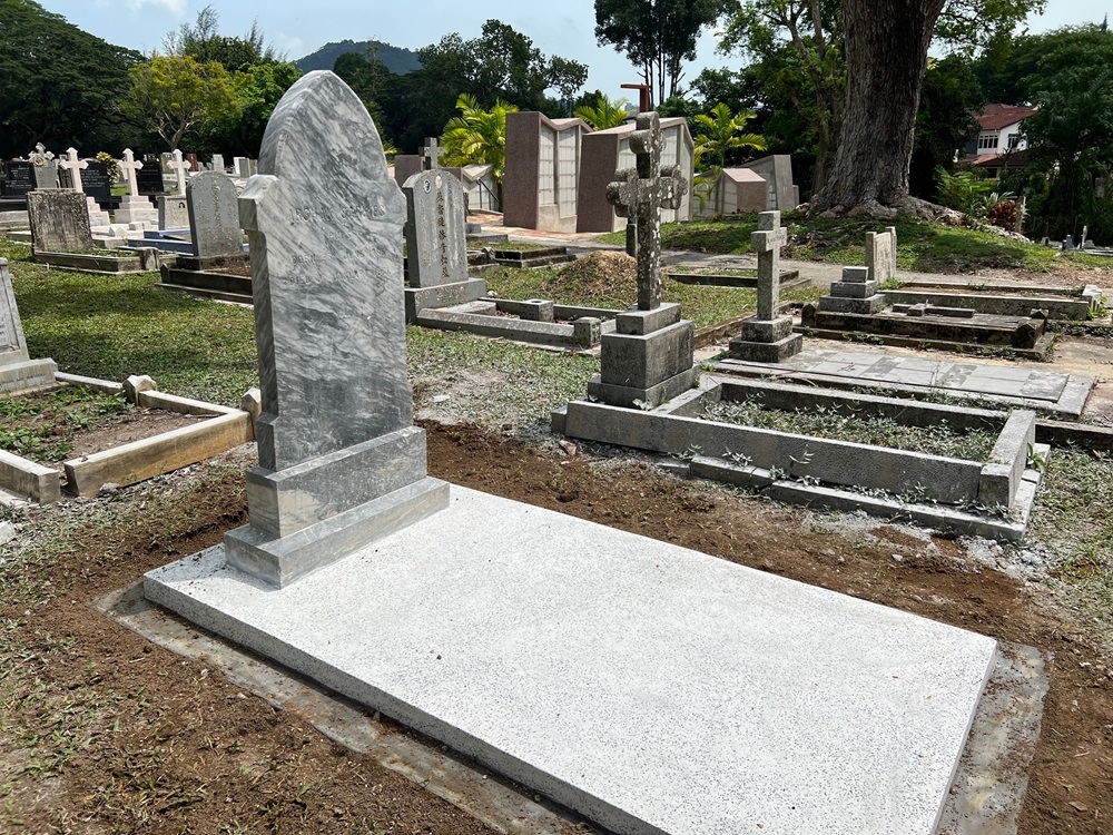 A new grave stone was made at Arshak Sarkies’ grave at the Western Road Cemetery. — Picture by Opalyn Mok 