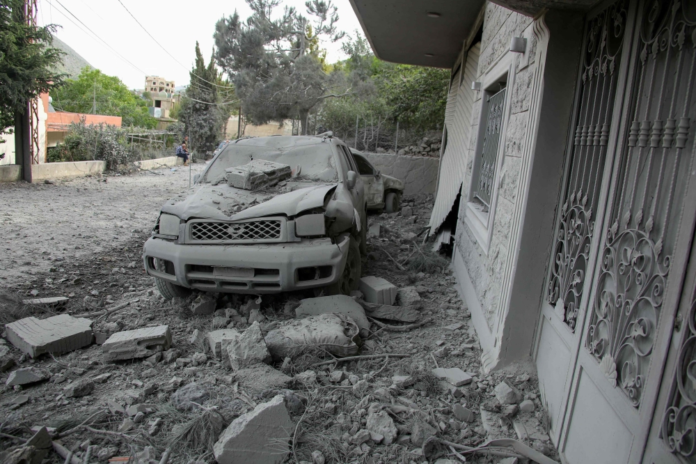 Rubble litters the area around a house which was hit overnight by an Israeli airstrike in the southern Lebanese village of Shebaa near the border on April 26, 2024. Lebanon’s Hezbollah movement said Saturday it had targeted northern Israel with drones and guided missiles after cross-border Israeli strikes killed three people, including two of its members. — AFP pic 