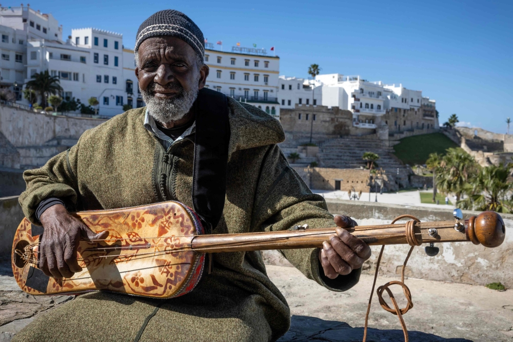 Abdellah El Gourd, a 77-year-old Moroccan legend of gnawa music, poses for a picture in the old city of Tangiers on April 23, 2024. The Moroccan city of Tangiers, which has a long history  as a haven of inspiration for American jazz musicians, will host Unesco’s International Jazz Day for the first time on April 30. — AFP pic 