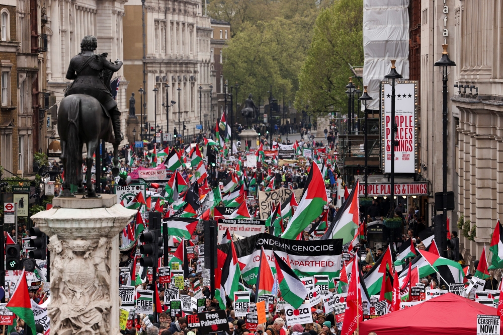 People protest during a march in solidarity with Palestinians in Gaza, amid the ongoing conflict between Israel and the Palestinian Islamist group Hamas, in London, Britain, April 27, 2024. — Reuters pic