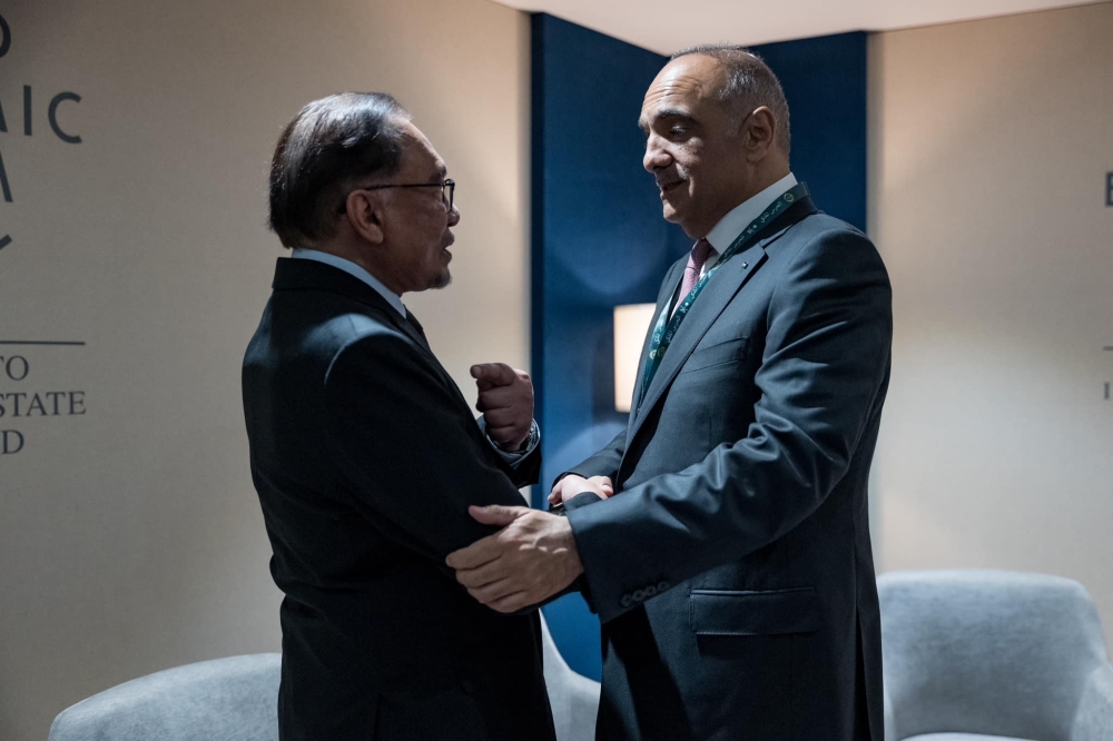 Prime Minister Datuk Seri Anwar Ibrahim meets with Jordan Prime Minister Bisher Hani Al-Khasawneh on the sidelines of the World Economic Forum (WEF) Special Meeting here today. — Picture via Facebook/Anwar Ibrahim