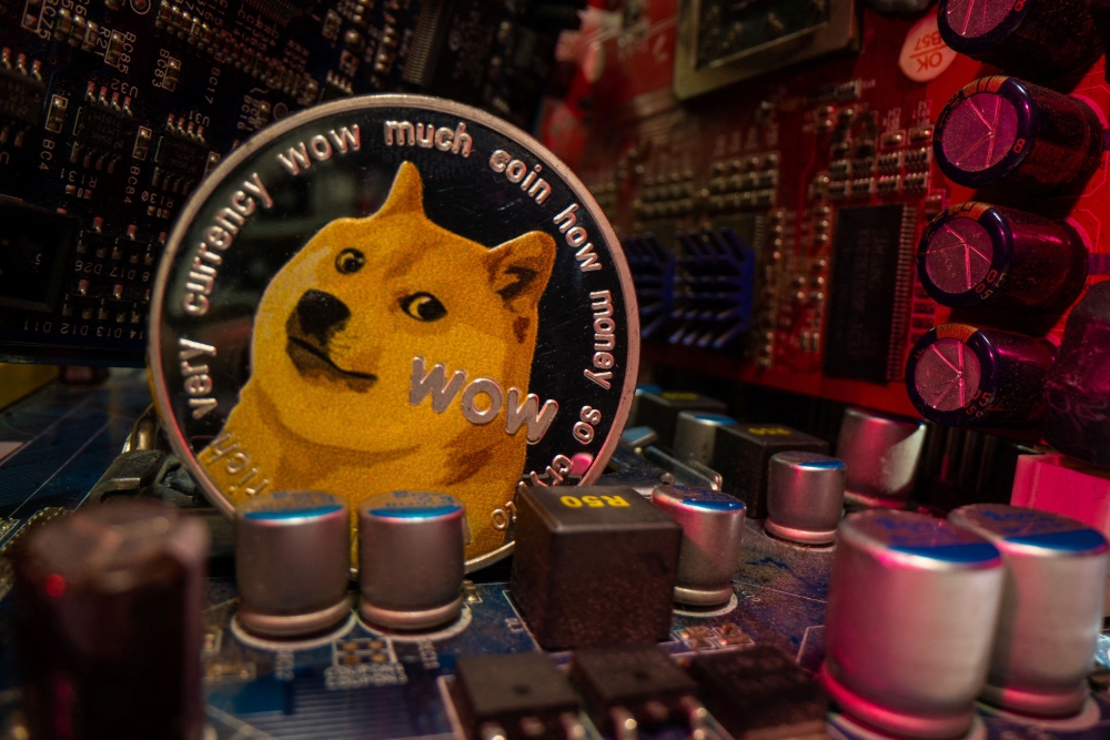 A representation of cryptocurrency Dogecoin is placed on a PC motherboard in this illustration taken June 16, 2023. — Reuters pic
