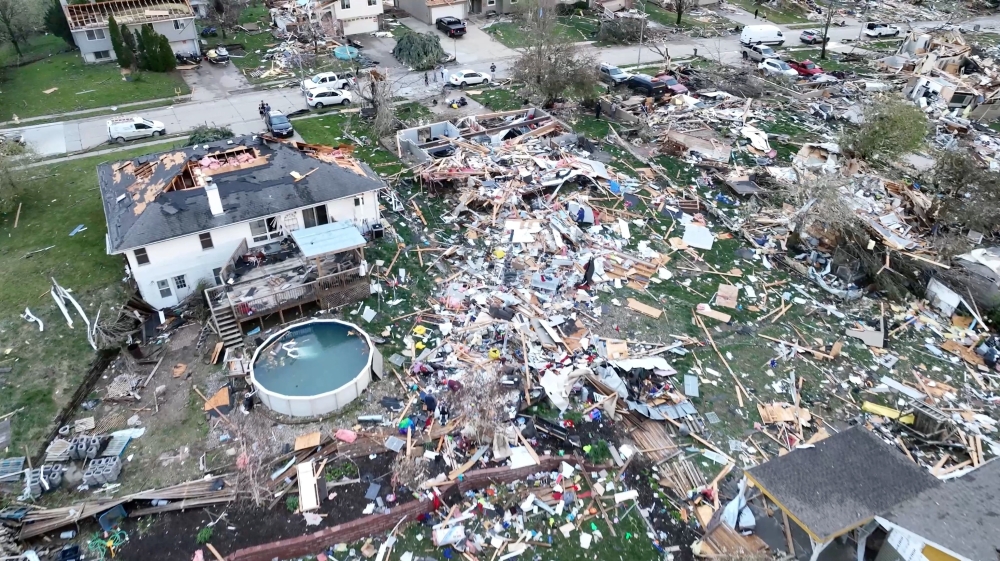 A drone view shows people inspecting the site of damaged buildings in the aftermath of a tornado in Omaha, Nebraska April 26, 2024, in this still image obtained from a social media video. — Alex freed/via Reuters pic