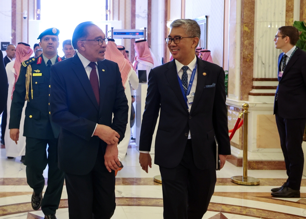 Prime Minister Datuk Seri Anwar Ibrahim (left) with Minister of Investment, Trade and Industry Datuk Seri Tengku Zafrul Abdul Aziz attend the opening of the World Economic Forum (WEF) Special Meeting in Riyadh April 28, 2024. — Bernama pic