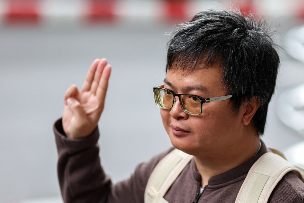 Arnon Nampa, a prominent activist and former human rights lawyer, flashes a three finger salute as he arrives ahead of a Thai criminal court's verdict in a case of allegedly having insulted the monarchy, at the criminal court in Bangkok, Thailand, September 26, 2023. — Reuters file pic