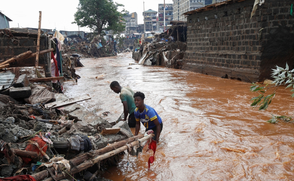 Residents sift through the rubble as they recover their belongings after the Nairobi river burst its banks and destroyed their homes within the Mathare Valley settlement in Nairobi, Kenya April 25, 2024. — Reuters pic  
