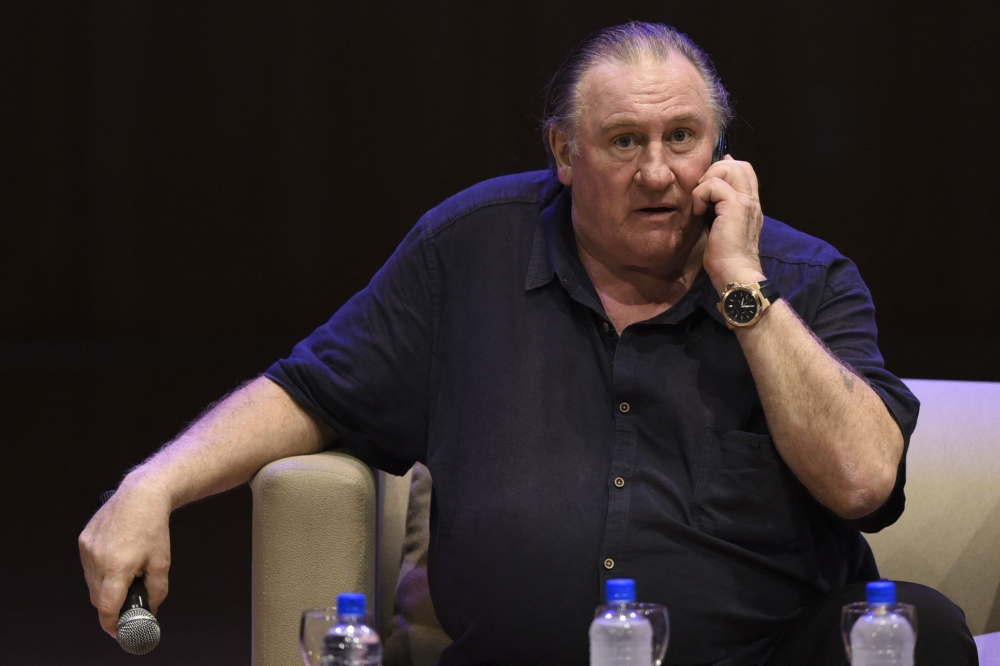 French actor Gerard Depardieu talks on the phone during a Master Class in Buenos Aires on December 19, 2016. French police summoned Depardieu over suspected sexual assault, a police source said today. — AFP pic
