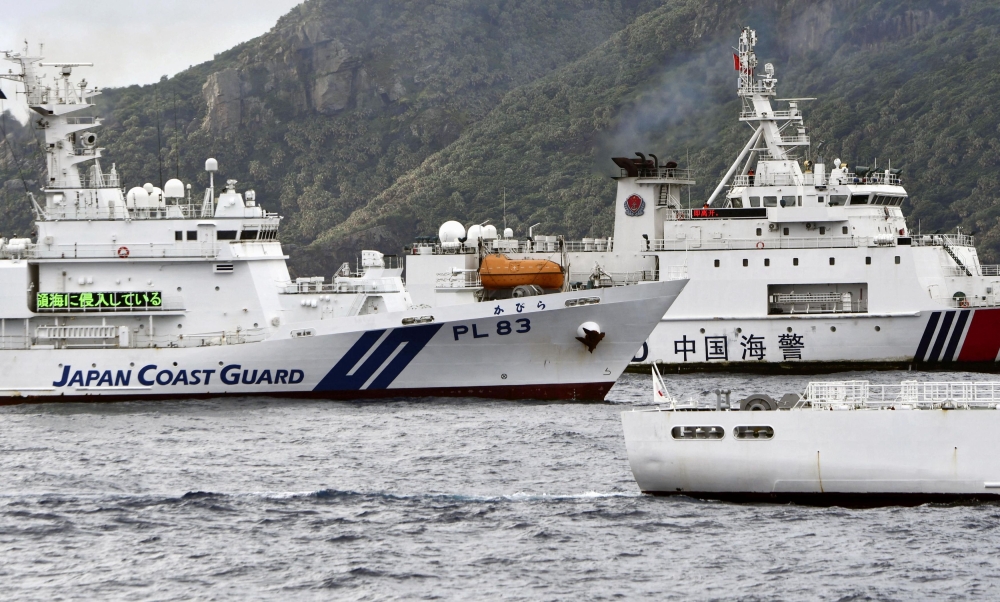 The Philippines said the China Coast Guard fired water cannon today at two of its vessels, causing damage to one of them, during a patrol near a reef off the South-east Asian country. — Kyodo via Reuters pic