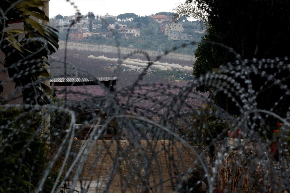 Razor wire lies near an abandoned house, amid ongoing cross-border hostilities between Hezbollah and Israeli forces, near Israel?s border with Lebanon in northern Israel March 19, 2024. — Reuters file pic