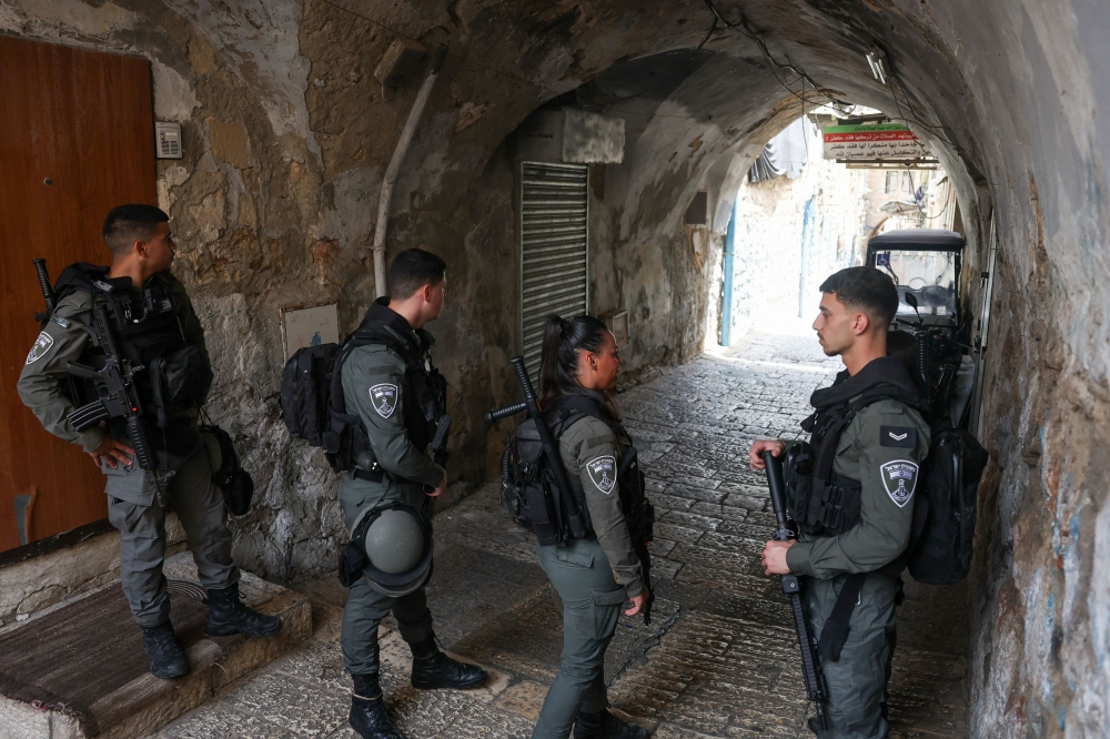 Israeli emergency personnel stand guard as they respond to a report of a stabbing attack, in Jerusalem April 30, 2024. — Reuters pic