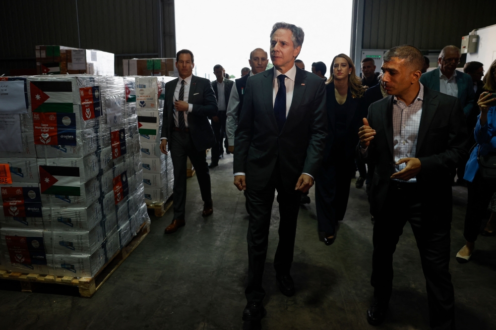 US Secretary of State Antony Blinken yesterday saw off a first convoy of Jordanian aid trucks to famished Gaza through a crossing newly opened by Israel, as he pointed to progress but called for more. — AFP pic