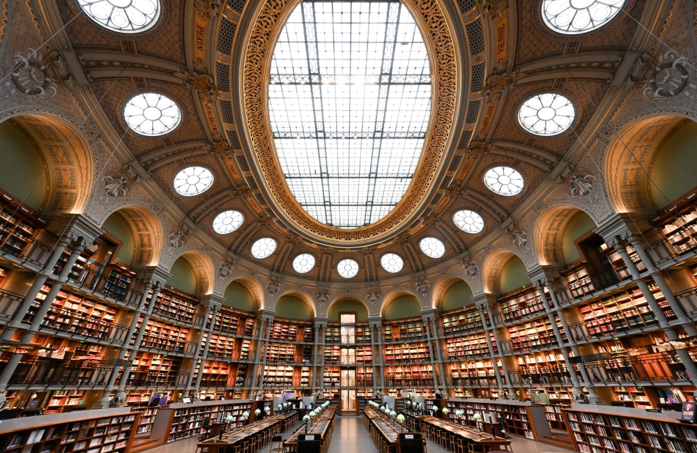 This picture taken in Paris on February 13, 2024 shows a general view of the ‘Salle Ovale Richelieu’ of the Richelieu-Louvois Library (Bibliotheque Nationale de France-National Library of France). France’s national library said on April 25, 2024, that it had removed four 19th-century books from its shelves whose emerald green covers were likely laced with highly poisonous arsenic. — AFP pic 