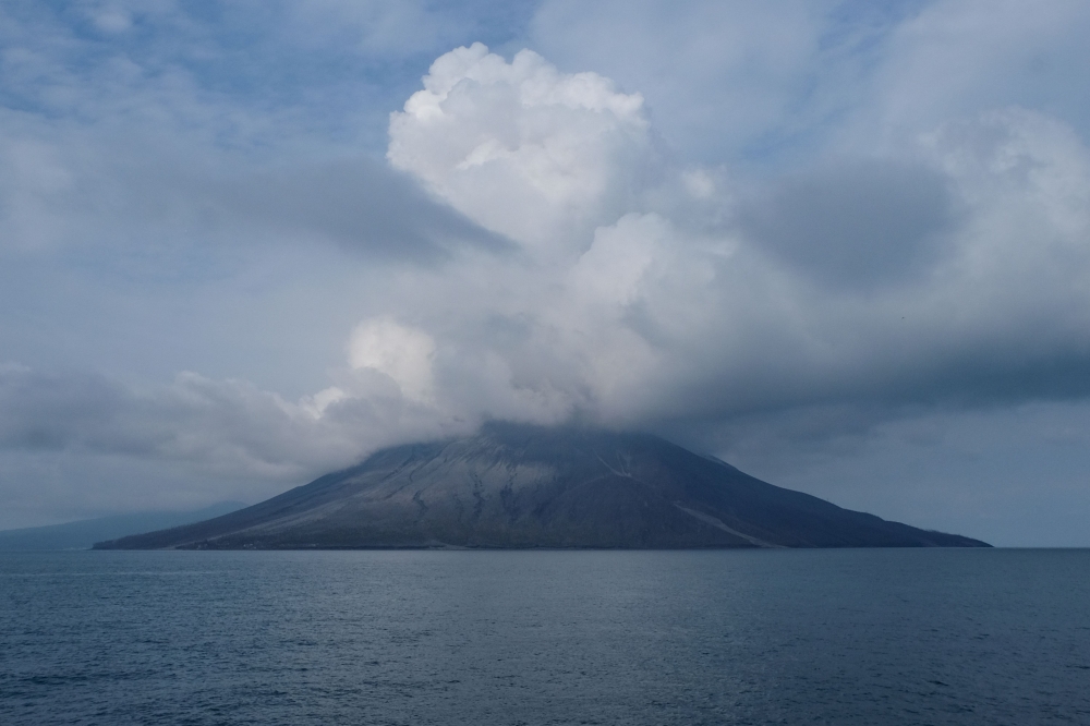 Mount Ruang volcano is seen from Sitaro, North Sulawesi, on May 1, 2024. Eruptions at a remote Indonesian volcano forced more than half a dozen airports to close with ash spreading as far as Malaysia, officials said on May 1, while authorities rushed to evacuate thousands due to tsunami fears. — AFP pic 