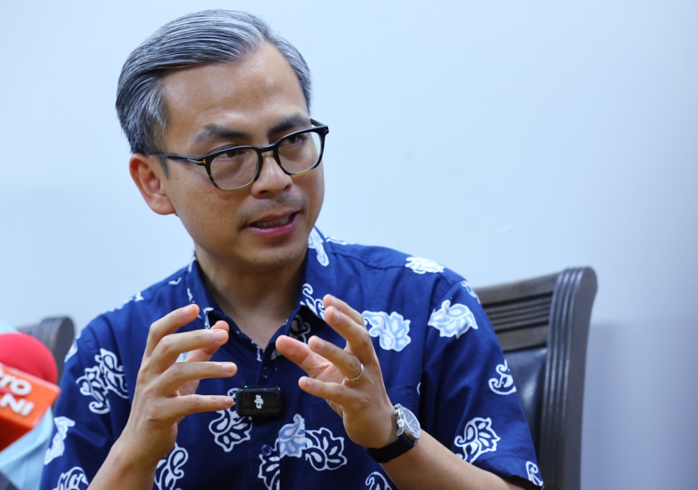 PKR Communications director Fahmi Fadzil speaks to reporters after inaugurating the Pakatan Harapan (PH) office in Putrajaya May 1, 2024. ― Bernama pic
